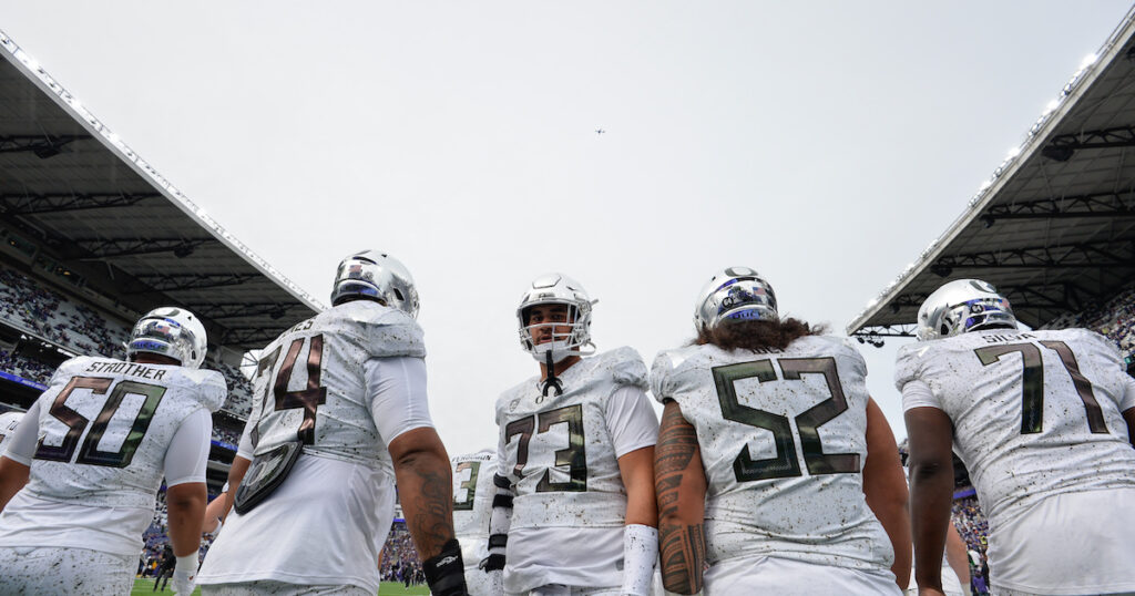 Oregon Ducks offensive lineman Kawika Rogers looks on during warmups 