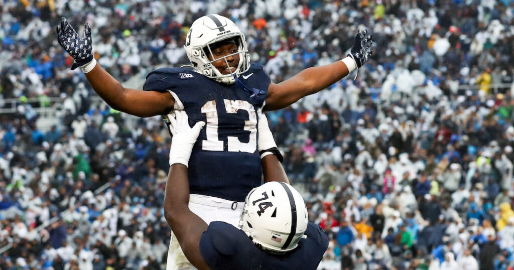 Penn State Nittany Lions running back Kaytron Allen celebrates with offensive linesman Olumuyiwa Fashanu