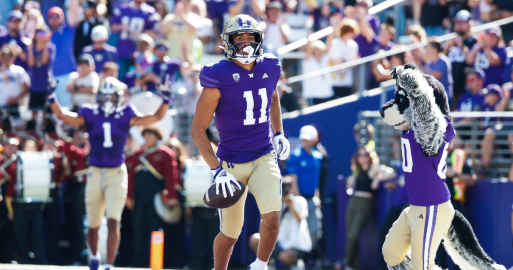 Sep 9, 2023; Seattle, Washington, USA; Washington Huskies wide receiver Jalen McMillan (11) reacts after catching a touchdown pass against the Tulsa Golden Hurricane during the second quarter at Alaska Airlines Field at Husky Stadium.