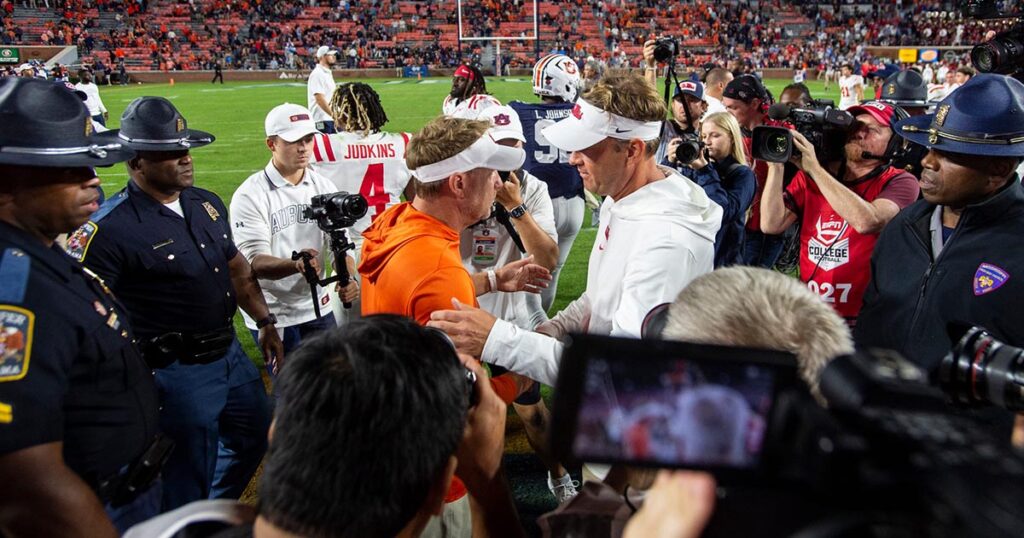 Auburn head coach Hugh Freeze and Ole Miss coach Lane Kiffin