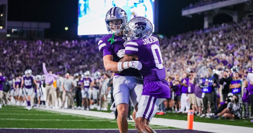 Kansas State receivers Jayce Brown and Jadon Jackson embrace