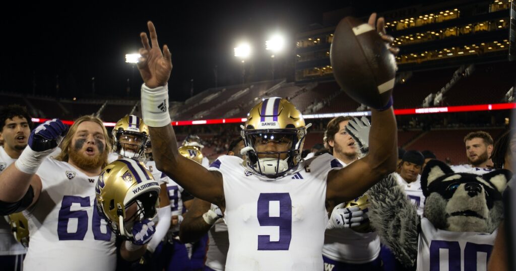 Oct 28, 2023; Stanford, California, USA; Washington Huskies quarterback Michael Penix Jr. (9) and his teammates celebrate their victory over the Stanford Cardinal at Stanford Stadium.