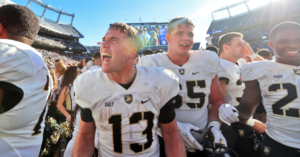 Nov 4, 2023; Denver, Colorado, USA; Army Black Knights quarterback Bryson Daily (13) and his teammates celebrate a 23-3 victory against the Air Force Falcons at Empower Field at Mile High.