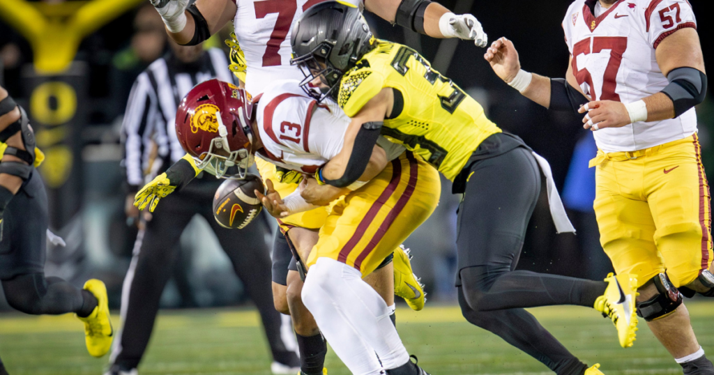 Oregon defensive back Evan Williams forces a fumble from USC quarterback Caleb Williams as the No. 6 Oregon Ducks host the USC Trojans Saturday, Nov. 11, 2023, at Autzen Stadium in Eugene, Ore