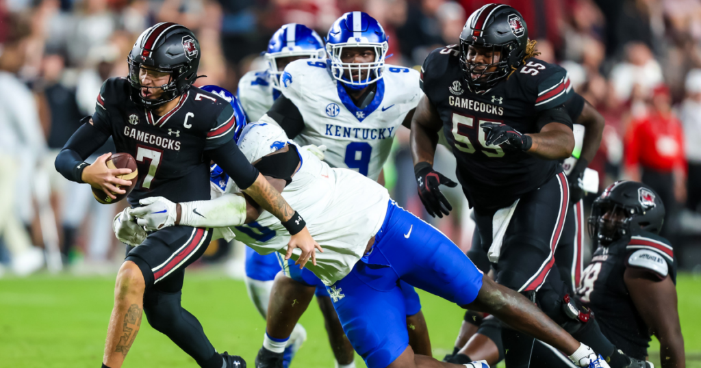 South Carolina Gamecocks quarterback Spencer Rattler (7) is brought down by Kentucky Wildcats defensive lineman Octavious Oxendine (8) in the second half at Williams-Brice Stadium