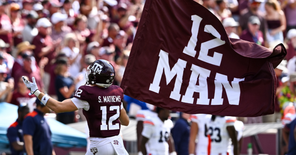 Sep 23, 2023; College Station, Texas, USA; Texas A&M Aggies linebacker Sam Mathews (12) waves the 12th Man flag during pre-game runout against the Auburn Tigers at Kyle Field.