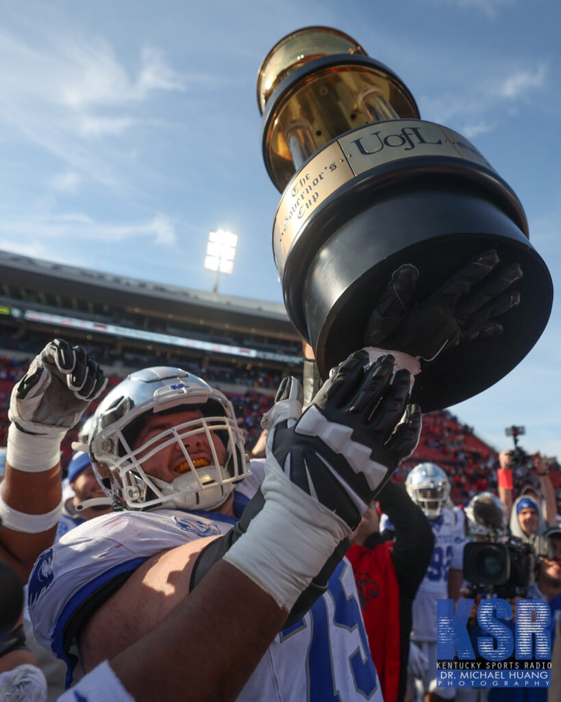 Eli Cox raises the Governor's Cup