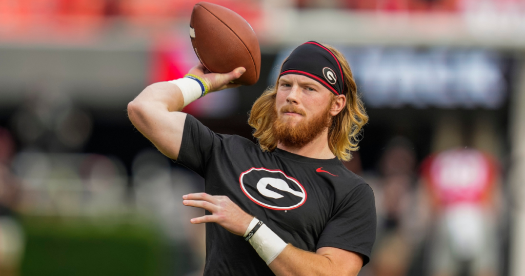 Georgia Bulldogs quarterback Brock Vandagriff (12) warms up on the field before the game against the South Carolina Gamecocks at Sanford Stadium