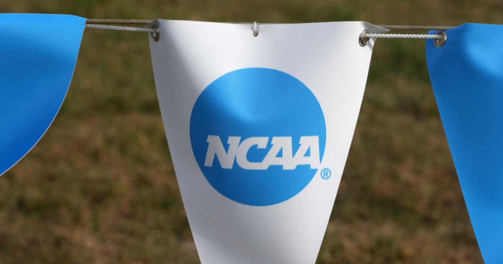 The NCAA logo on a banner at the NCAA cross country championships course at Panorama Farms