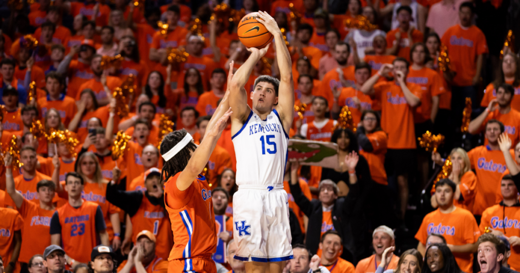 Kentucky Wildcats guard Reed Sheppard (15) attempts a three-pointer over Florida Gators guard Walter Clayton Jr.