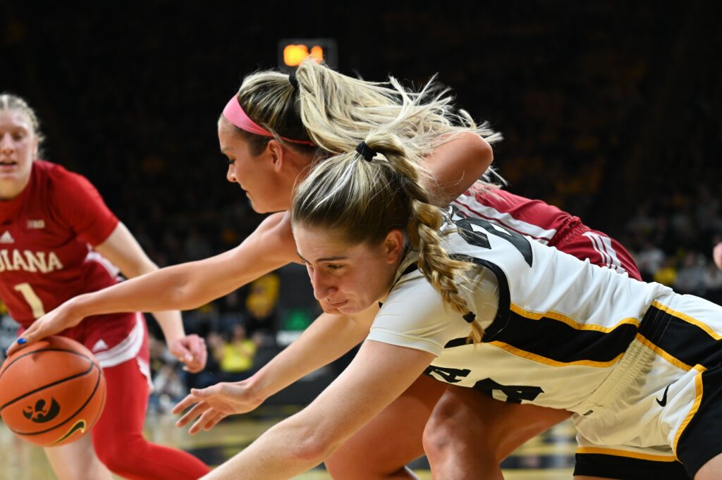 Kate Martin battles Sydney Parrish for a rebound