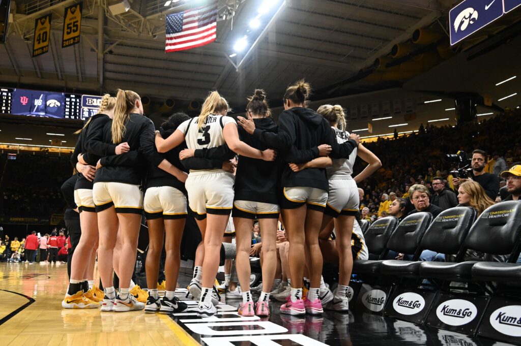 The Hawkeyes huddle during a timeout