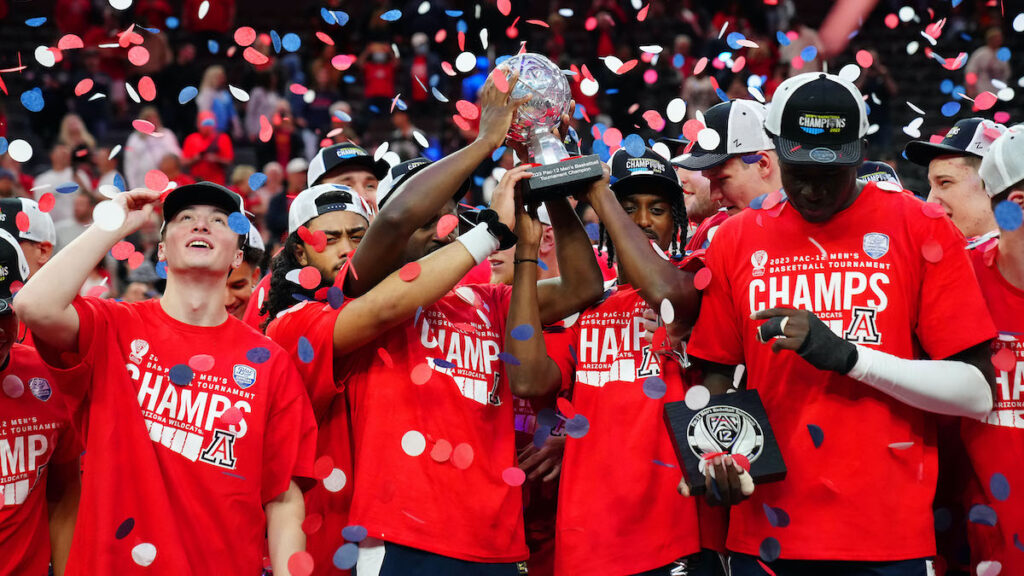 Mar 11, 2023; Las Vegas, NV, USA; The Arizona Wildcats celebrate after defeating the UCLA Bruins 61-59 to win the Pac-12 Championship at T-Mobile Arena.
