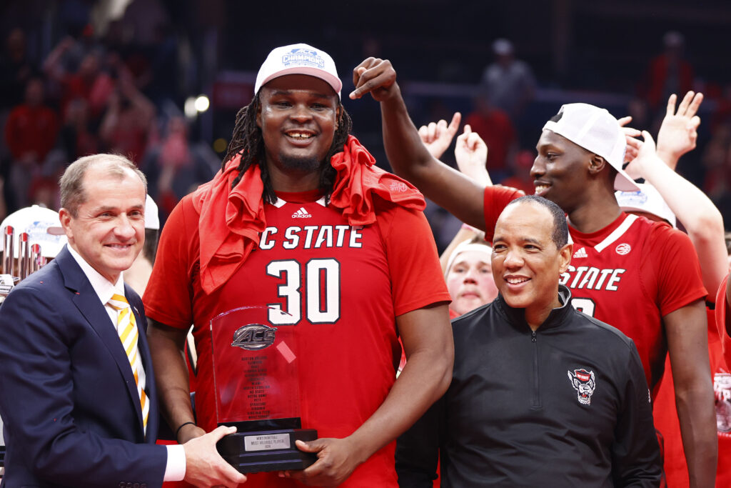 North Carolina State Wolfpack forward DJ Burns Jr. (30) poses with the MVP trophy after defeating the North Carolina Tar Heels for the ACC Conference Championship at Capital One Arena - Amber Searls-USA TODAY Sports