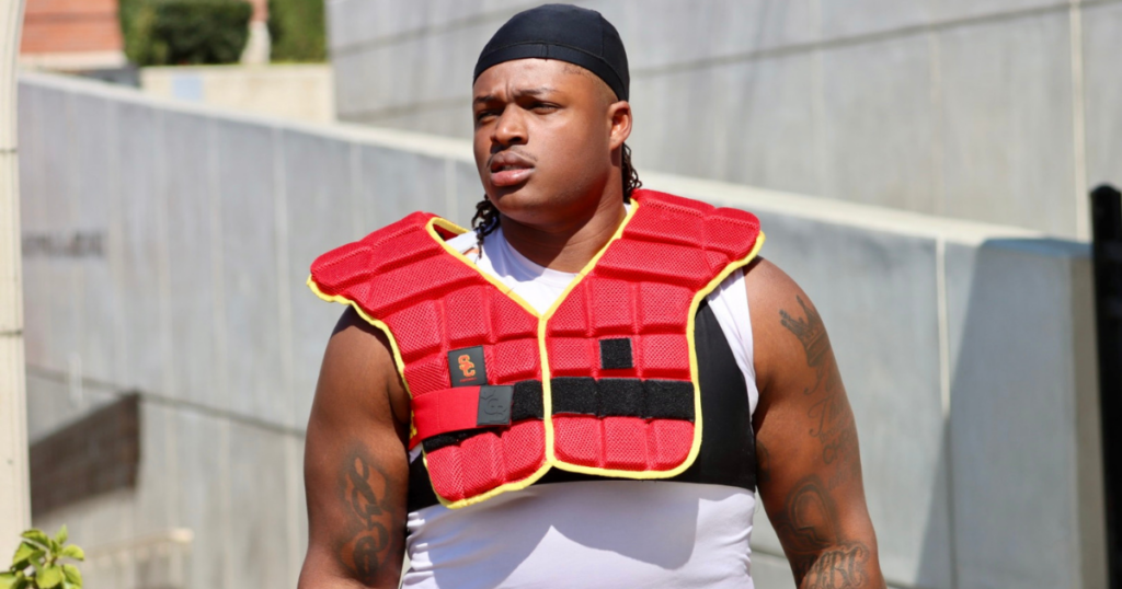 USC defensive lineman Isaiah Raikes walks out to a spring ball practice with the Trojans