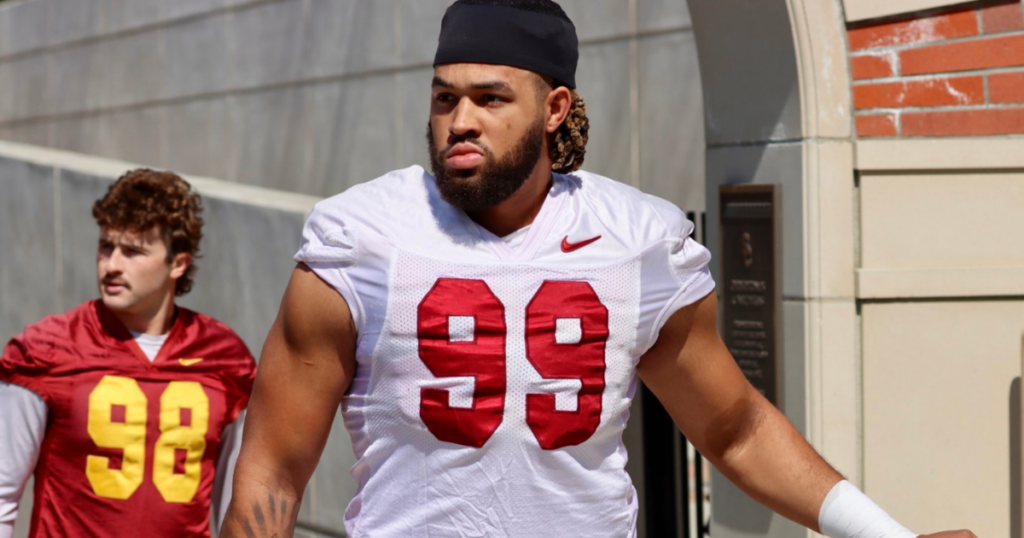 USC defensive lineman Nate Clifton walks out to practice with the Trojans