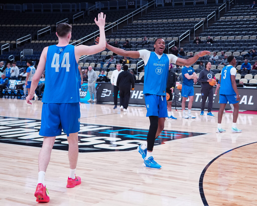 Kentucky Wildcats forward Ugonna Onyenso (33) reacts to making a shot along with forward Zvonimir Ivisic (44) during the NCAA first round practice session at PPG Paints Arena - Gregory Fisher-USA TODAY Sports