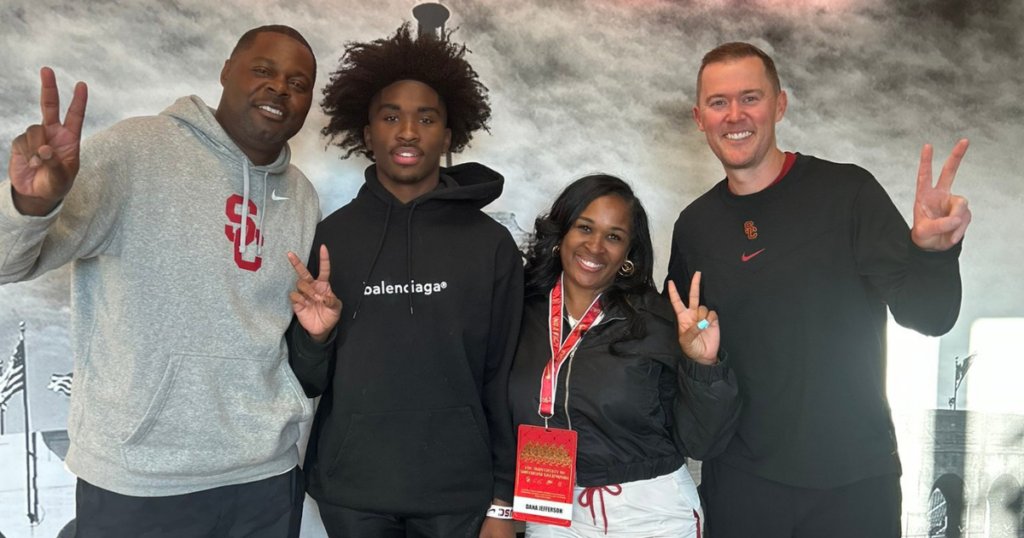 Class of 2025 wide receiver Romero Ison poses with USC wide receivers coach Dennis Simmons and head coach Lincoln Riley