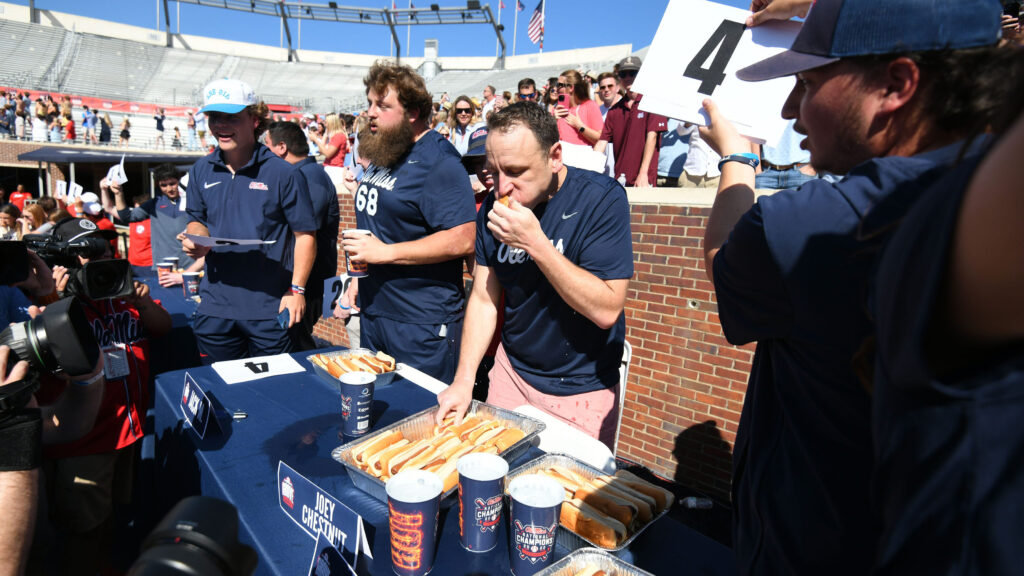 Joey Chestnut eats hot dogs during a competition during the Ole Miss Grove Bowl Games at Vaught-Hemingway Stadium in Oxford, Miss., on Saturday, Apr. 13, 2024. Mandatory Credit: © Bruce Newman/Special to the Clarion Ledger / USA TODAY NETWORK