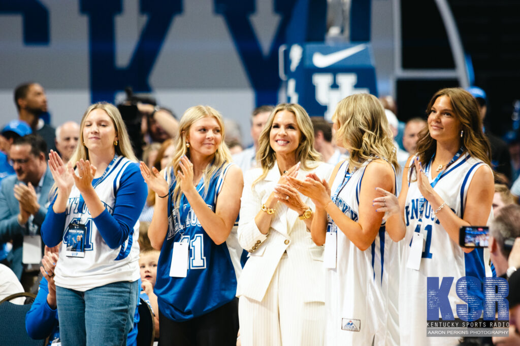 Lee Anne Pope and her daughters at Mark Pope's introductory press conference - Aaron Perkins, Kentucky Sports Radio