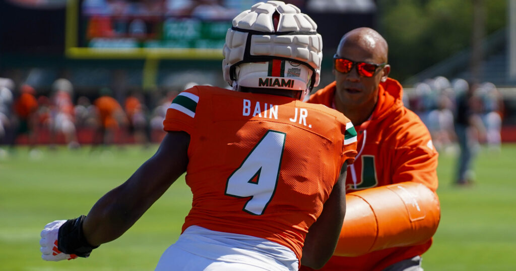 Jason Taylor with Rueben Bain