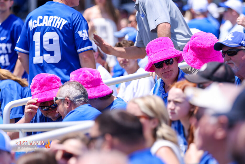 Kentucky Baseball fans sport pink fuzzy hats at the NCAA Tournament Lexington Regional - Mont Dawson