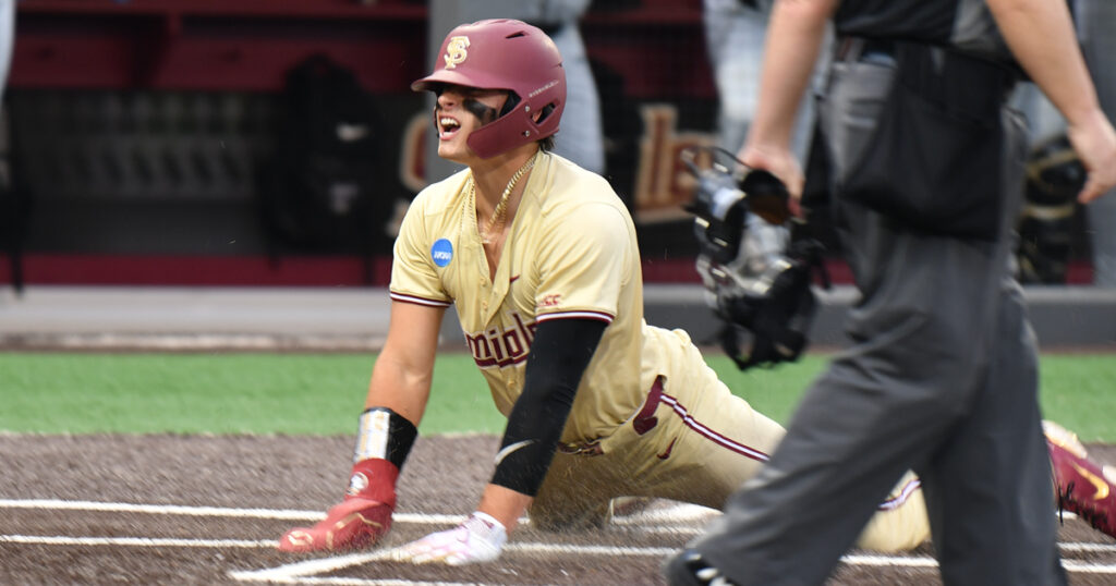 Florida State slugger Marco Dinges slides home this past weekend in the NCAA Regionals. (Ben Spicer/Warchant)