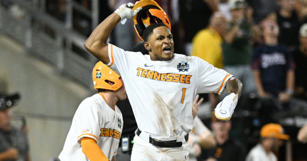 Christian Moore celebrates scoring the tying run in the College World Series. Credit: Dylan Widger-USA TODAY Sports