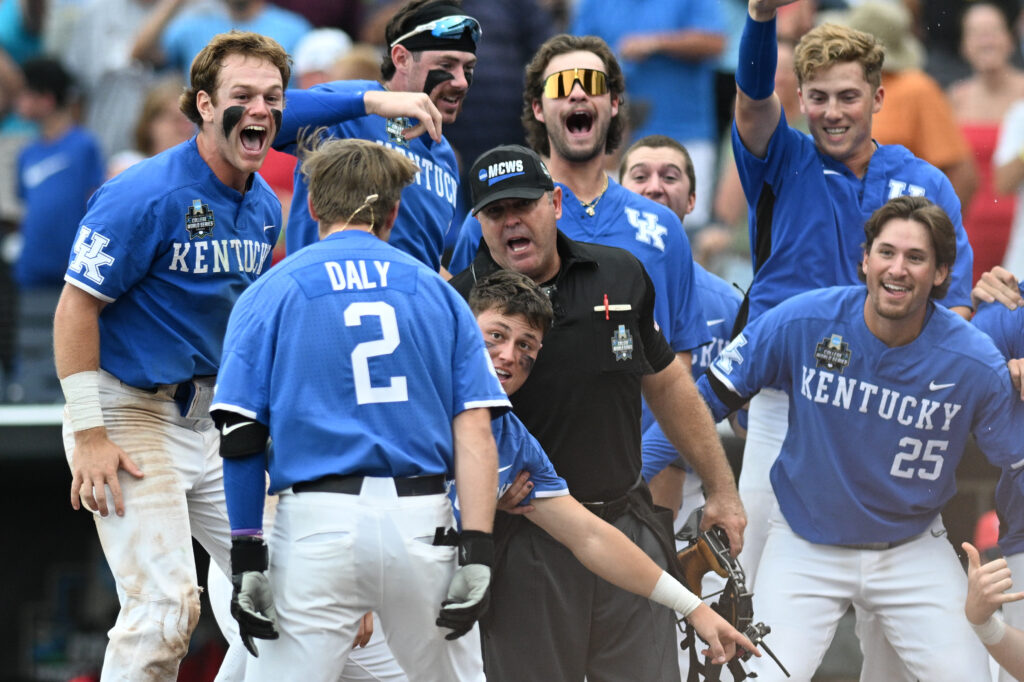 Jun 15, 2024; Omaha, NE, USA; Kentucky Wildcats third baseman Mitchell Daly (2) and teammate celebrate after hitting a walk off home run against the NC State Wolfpack during the tenth inning at Charles Schwab Filed Omaha. (Steven Branscombe-USA TODAY Sports)