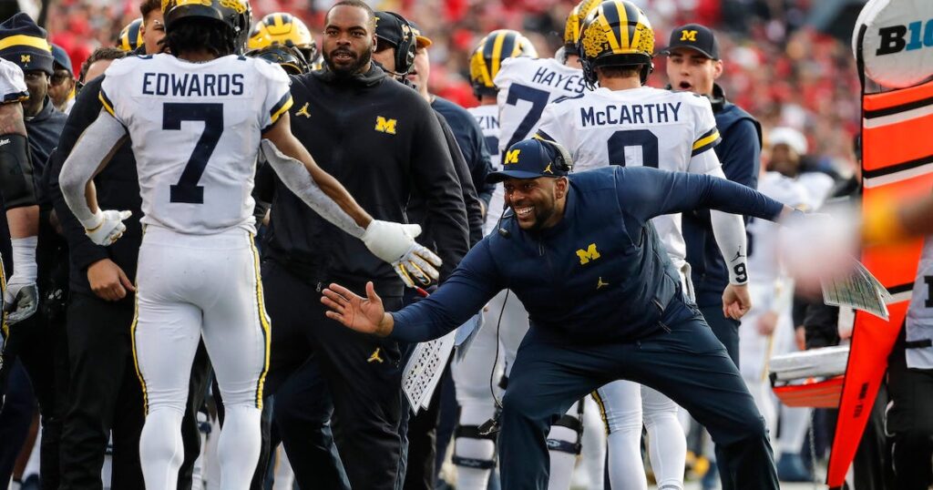 Michigan RB Donovan Edwards and new HC Sherrone Moore at Ohio State in 2022. (Junfu Han/Detroit Free Press)