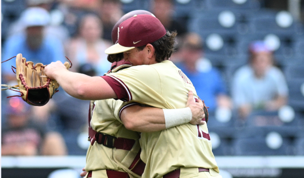 Florida State Seminoles pitcher Connor Hults (15) and catcher Jaxson West (20) celebrate after defeating the North Carolina Tar Heels at Charles Schwab Field Omaha. (Steven Branscombe-USA TODAY Sports)