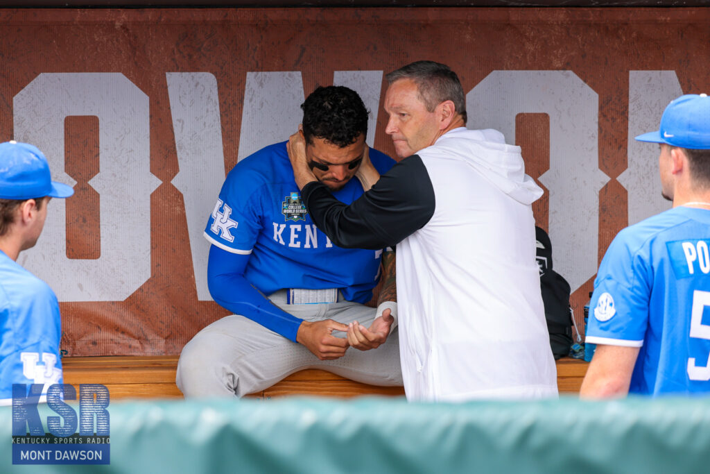 Kentucky athletic director Mitch Barnhart consoles catcher Devin Burkes after the Cats' loss to Florida in the College World Series - Mont Dawson, Kentucky Sports Radio