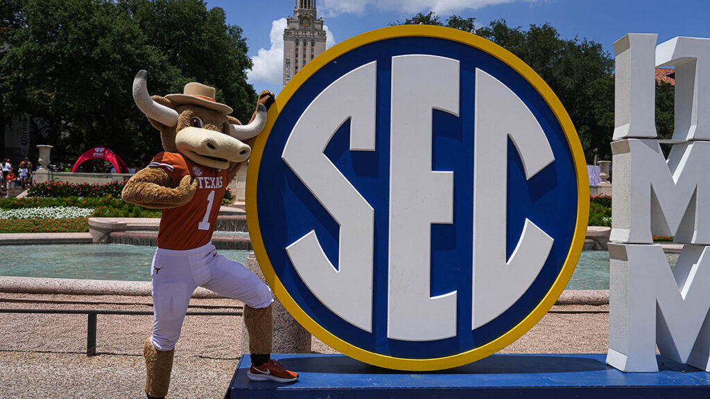 Texas Longhorns mascot poses with the Southeastern Conference logo. Mandatory Credit: Aaron E. Martinez/American-Statesman / USA TODAY NETWORK