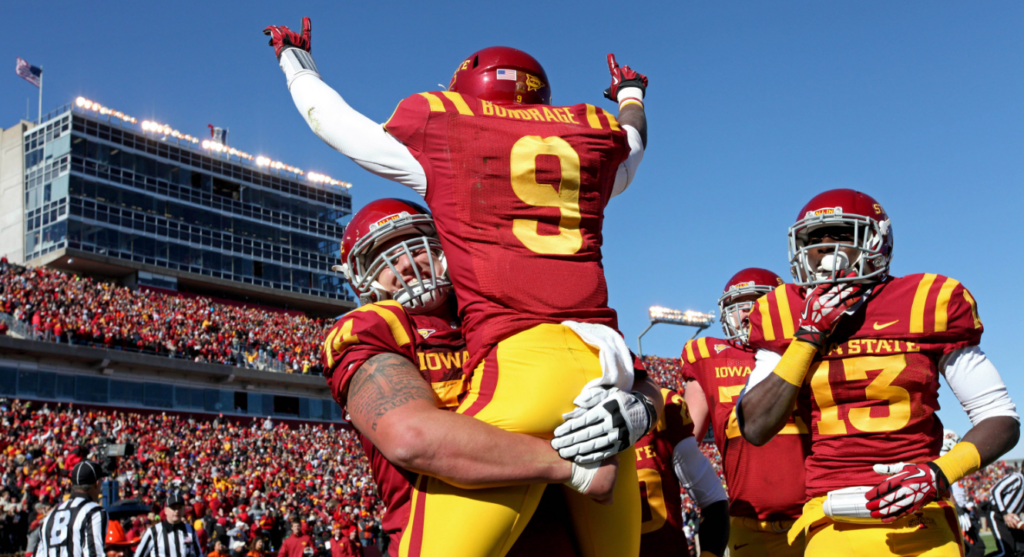 Iowa State Cyclones wide receiver Quenton Bundrage (9) celebrates his touchdown with offensive lineman Tom Farniok (74) during the second quarter against the Oklahoma State Cowboys at Jack Trice Stadium in 2013. (Brace Hemmelgarn-USA TODAY Sports)