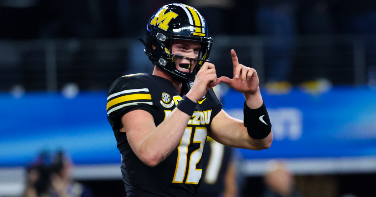 Missouri quarterback Brady Cook heads to the locker room after an apparent non-contact injury