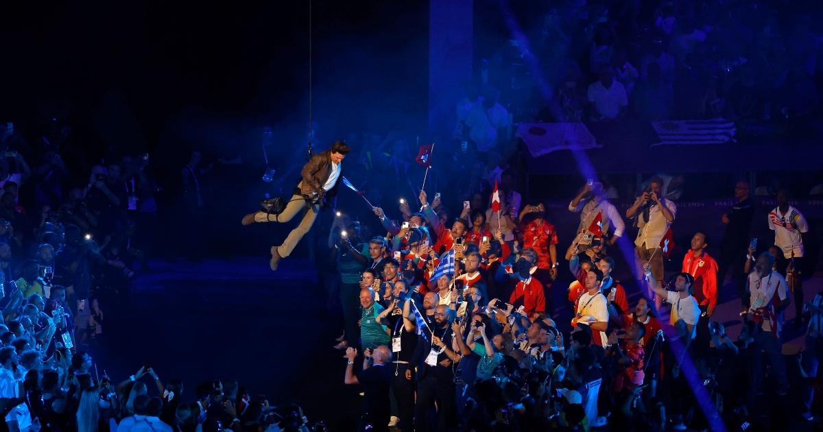 Tom Cruise makes a spectacular jump from the roof of the Stade de France during the closing ceremony of the Olympic Games in Paris