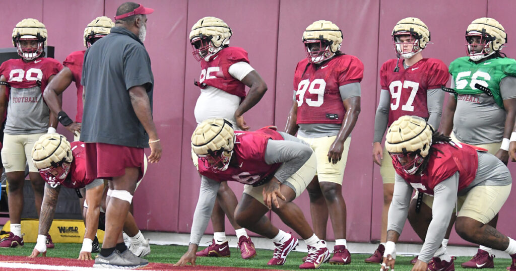 Florida State defensive line coach Odell Haggins runs his players through preseason practice. (Ben Spicer/Warchant)