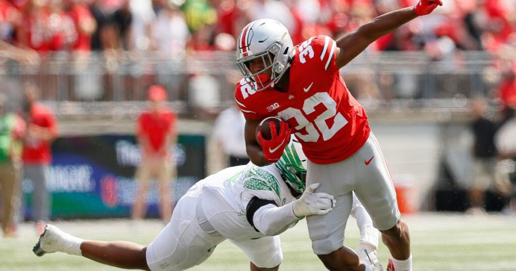 Ohio State running back TreVeyon Henderson runs through contact against Oregon during the 2021 season. (Adam Cairns/Columbus Dispatch)