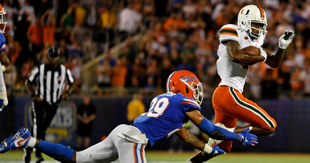 Aug 24, 2019; Orlando, FL, USA; Florida Gators defensive back Jeawon Taylor (29) attempts to bring down Miami Hurricanes wide receiver Mike Harley (3) during the second half at Camping World Stadium. Mandatory Credit: Jasen Vinlove-USA TODAY Sports