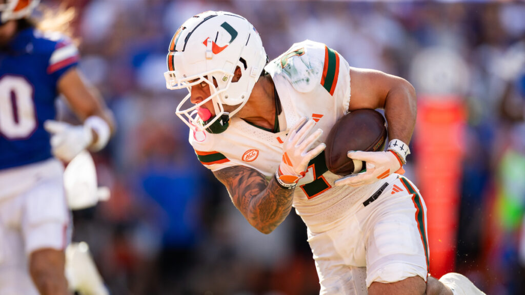 Miami Hurricanes wide receiver Xavier Restrepo (7) catches a pass and runs for a touchdown against the Florida Gators during the first half at Ben Hill Griffin Stadium. (Matt Pendleton-USA TODAY Sports)