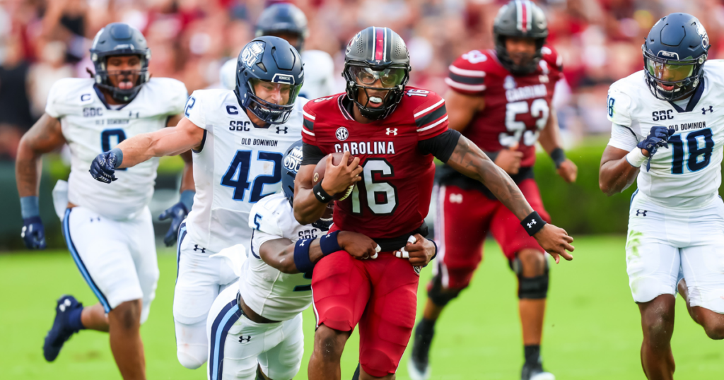 Aug 31, 2024; Columbia, South Carolina, USA; South Carolina Gamecocks quarterback LaNorris Sellers (16) is tackled by Old Dominion Monarchs safety Jahron Manning (5) in the first quarter at Williams-Brice Stadium. Mandatory Credit: Jeff Blake-USA TODAY Sports