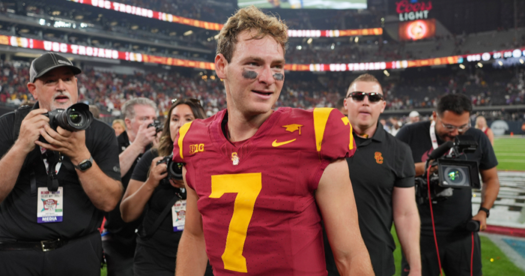 USC quarterback Miller Moss celebrates on the field after the Trojans' win over LSU