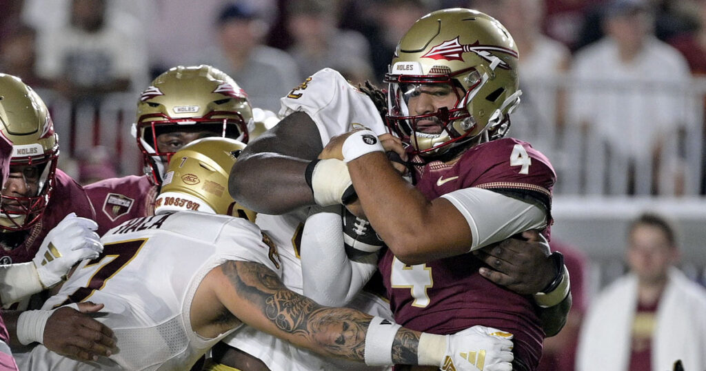 Florida State Seminoles quarterback DJ Uiagalelei (4) is tackled against the Boston College Eagles at Doak S. Campbell Stadium. (Melina Myers-USA TODAY Sports)