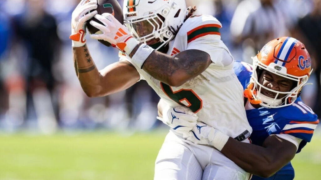 Miami Hurricanes running back Damien Martinez (6) makes a catch against Florida Gators linebacker Grayson Howard (10) during the first half at Ben Hill Griffin Stadium. (Matt Pendleton-USA TODAY Sports)