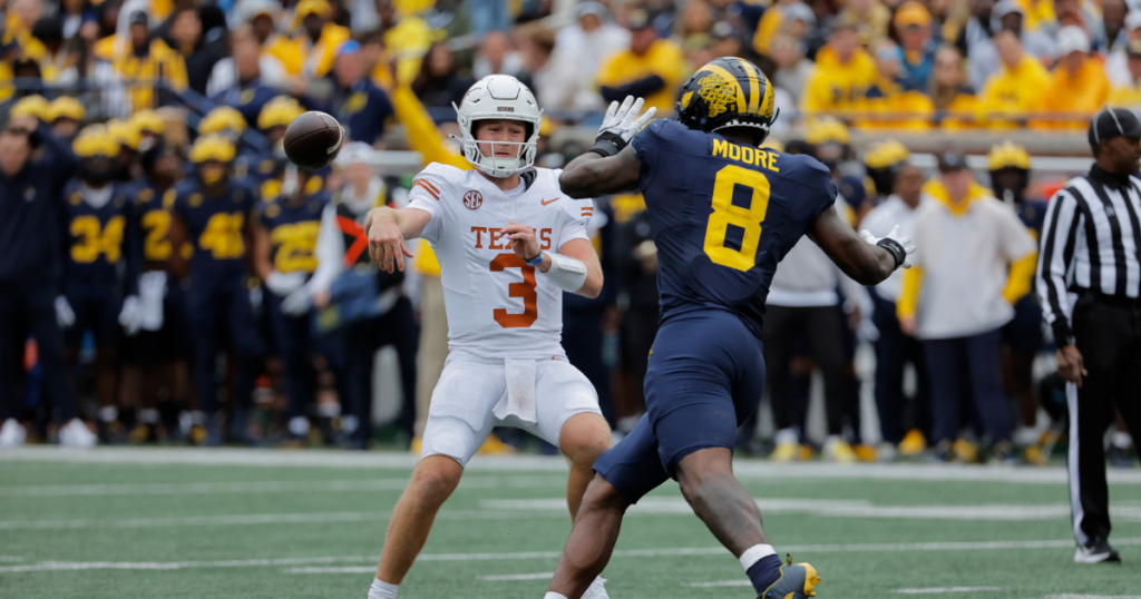 Michigan Wolverines football EDGE Derrick Moore pressuring Texas quarterback Quinn Ewers. (Photo by Rick Osentoski-Imagn Images)