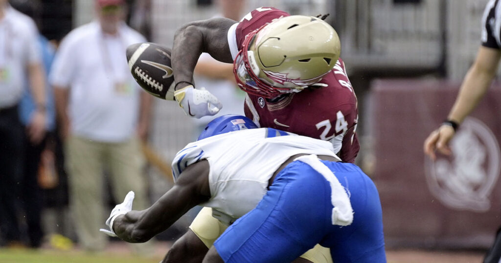 Memphis Tigers defensive back An'Darius Coffey (4) forces a fumble by Florida State Seminoles running back Roydell Williams (24) during the first half at Doak S. Campbell Stadium. (Melina Myers-Imagn Images)