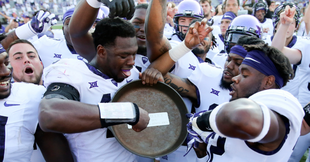 Sep 16, 2017; Fort Worth, TX, USA; TCU Horned Frogs players celebrate with the Iron Skillet after the game against the Southern Methodist Mustangs at Amon G. Carter Stadium. Mandatory Credit: Kevin Jairaj-Imagn Images