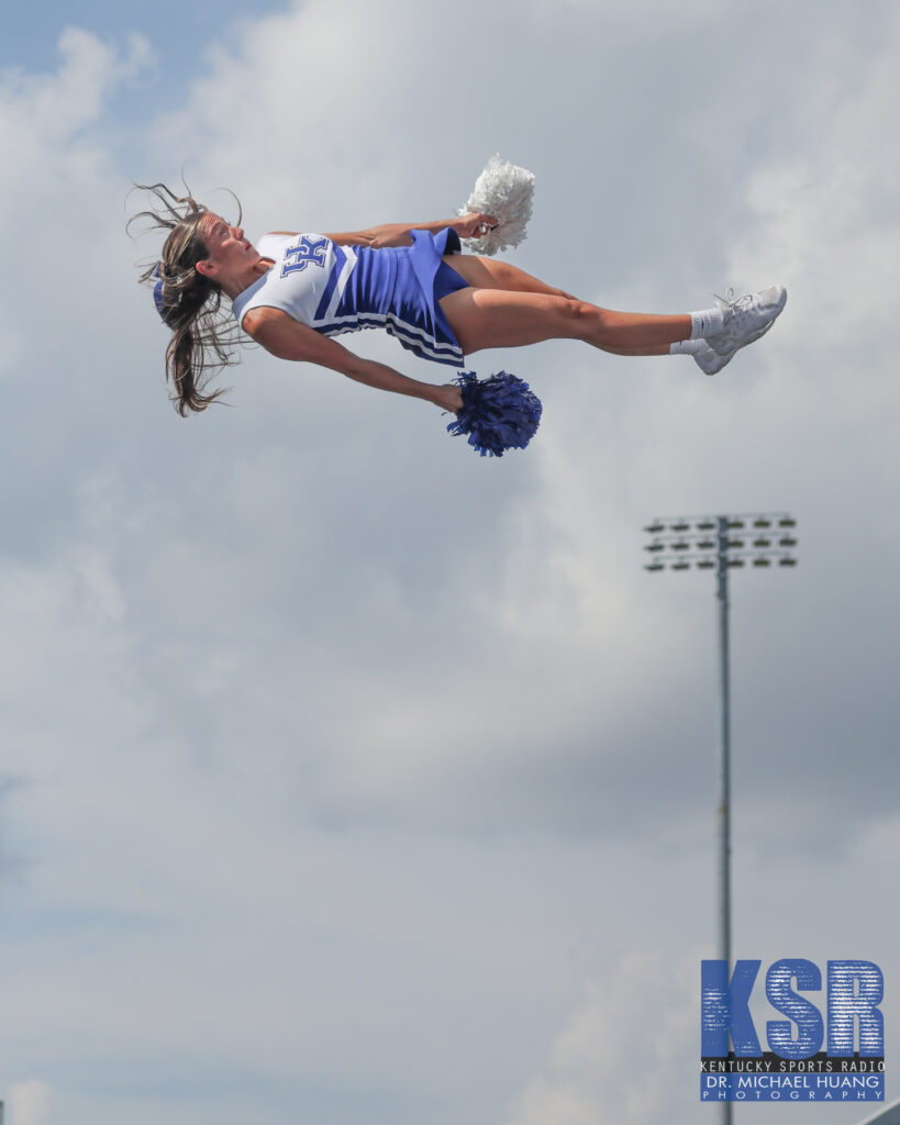 Kentucky cheerleader soars through the air during Kentucky vs. Ohio - Dr. Michael Huang, Kentucky Sports Radio