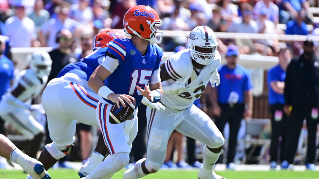 Sep 21, 2024; Starkville, Mississippi, USA; Florida Gators quarterback Graham Mertz (15) rolls out to pass against the Mississippi State Bulldogs during the third quarter at Davis Wade Stadium at Scott Field. Mandatory Credit: Matt Bush-Imagn Images