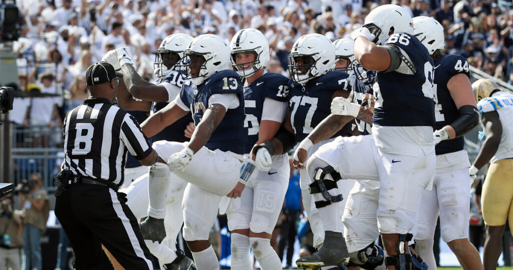 Penn State Nittany Lions running back Kaytron Allen (13) celebrates with his teammates after scoring a touchdown during the third quarter against the UCLA Bruins at Beaver Stadium. (Mandatory Credit: Matthew O'Haren-Imagn Images)